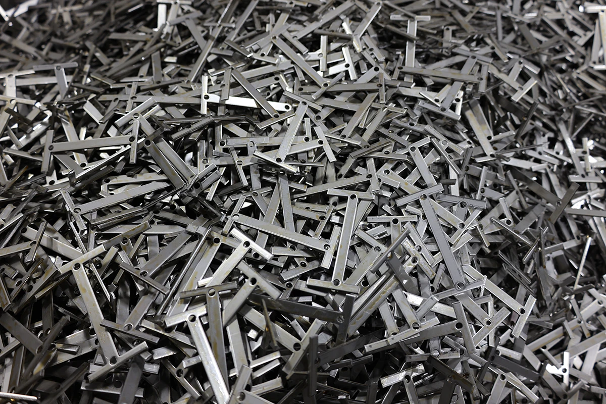 Finished stamped metal brackets batch for custom firearm component manufacturing